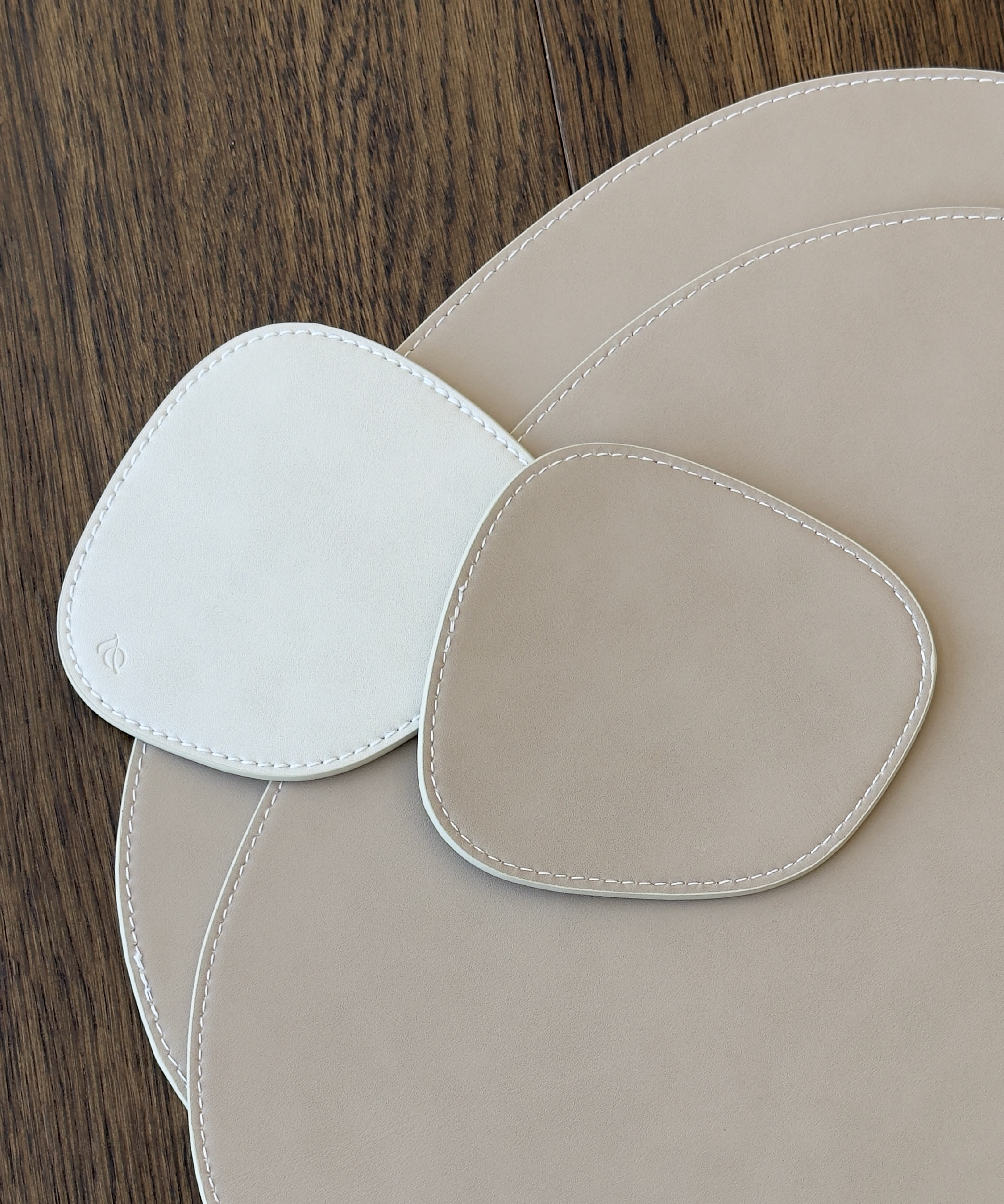 Asymmetrical reversible taupe/cream faux leather coasters | Jade