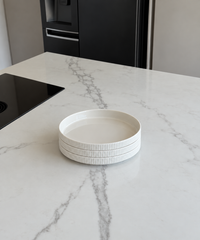 Set of 3 small, ribbed, cream-white, glossy plates | Nia