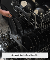 Handmade black ceramic tableware set in organic shape