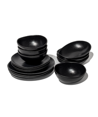 Handmade black ceramic tableware set in organic shape