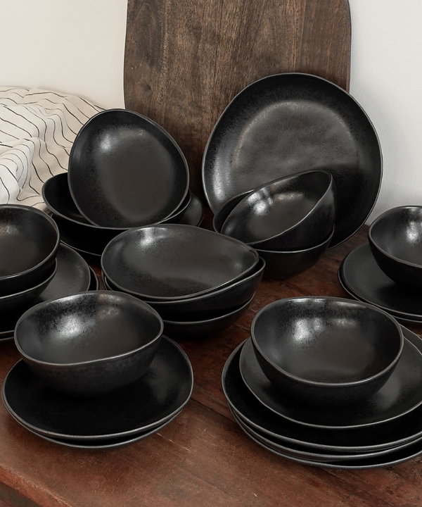 Handmade black ceramic tableware set in organic shape