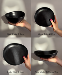 Handmade black ceramic tableware set in organic shape