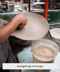 Handmade black ceramic tableware set in organic shape