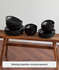 Handmade black ceramic tableware set in organic shape