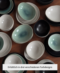 Handmade black ceramic tableware set in organic shape